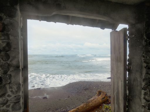 looking through a doorway to the waves beyond